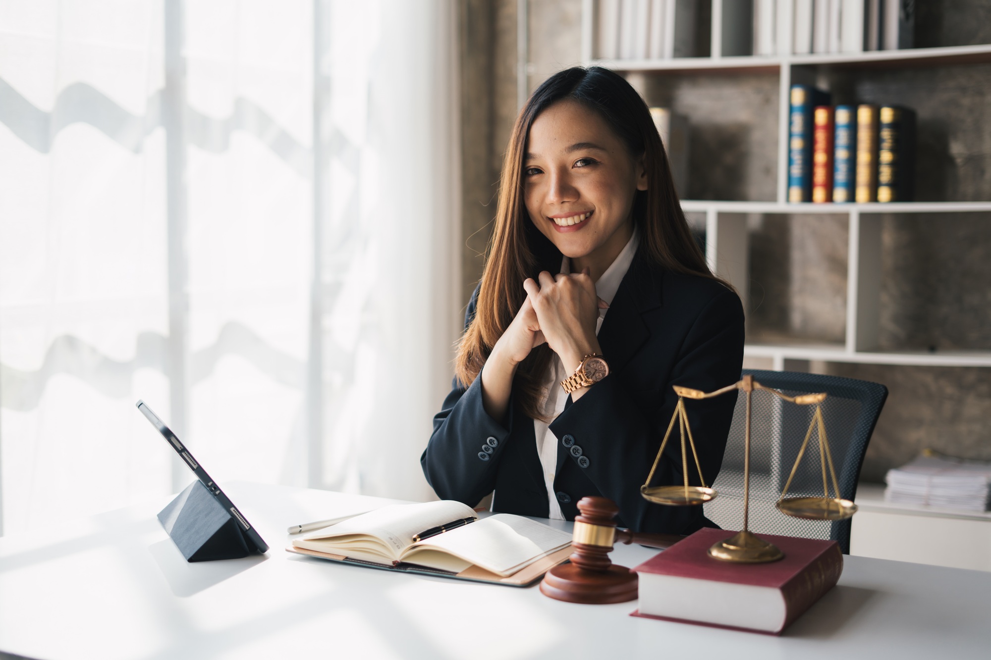 Attractive young lawyer in office Business woman and lawyers discussing contract papers with brass s